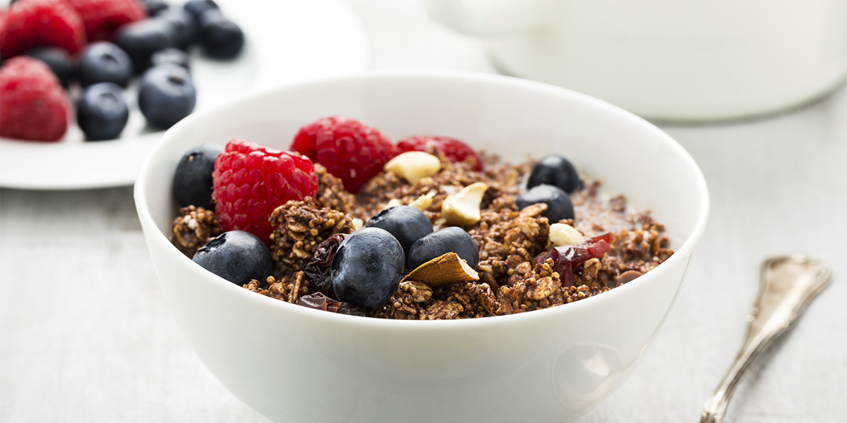 A healthy bowl of granola with berries for breakfast
