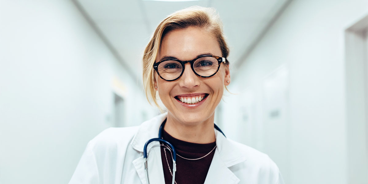 Female doctor standing in hospital corridor