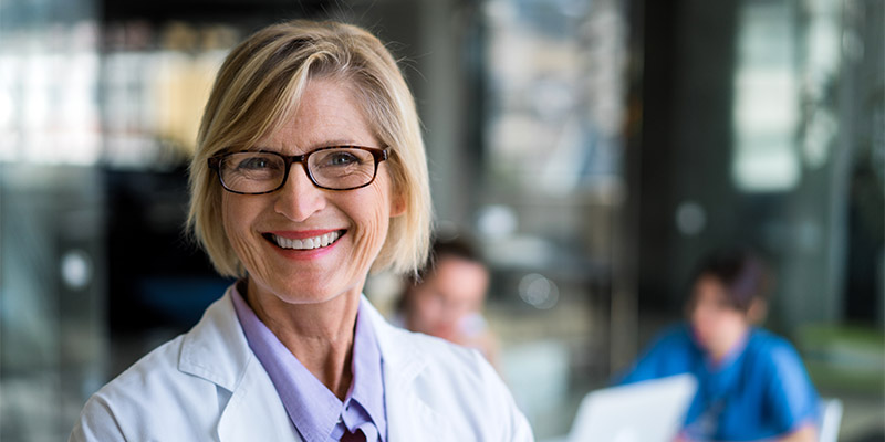 Happy female doctor in hospital