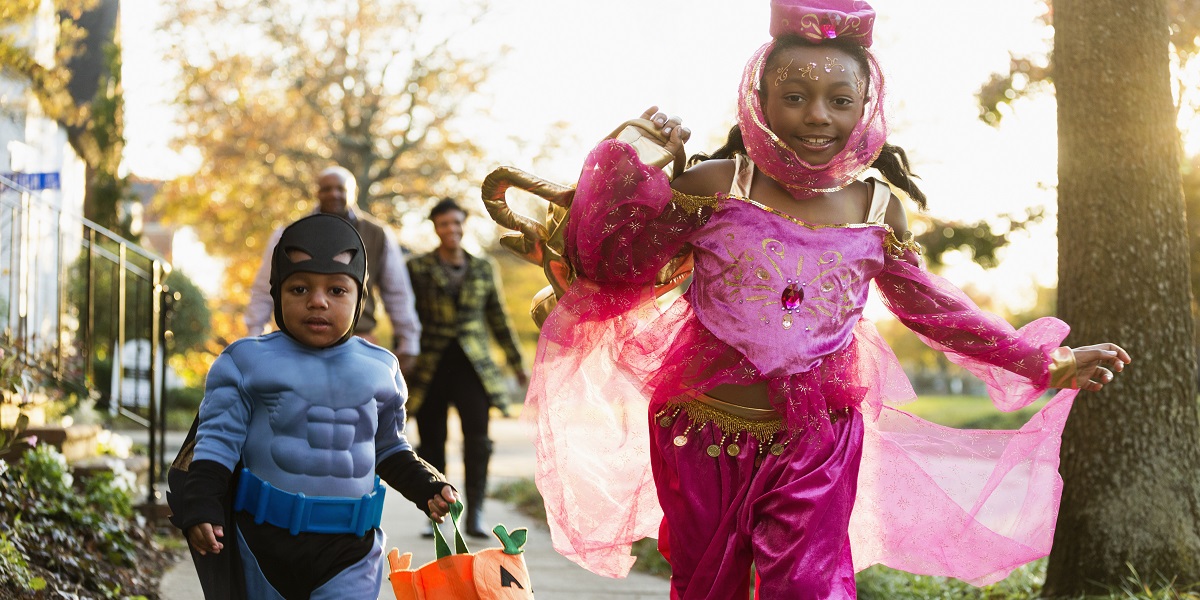 African American children trick-or-treating on Halloween