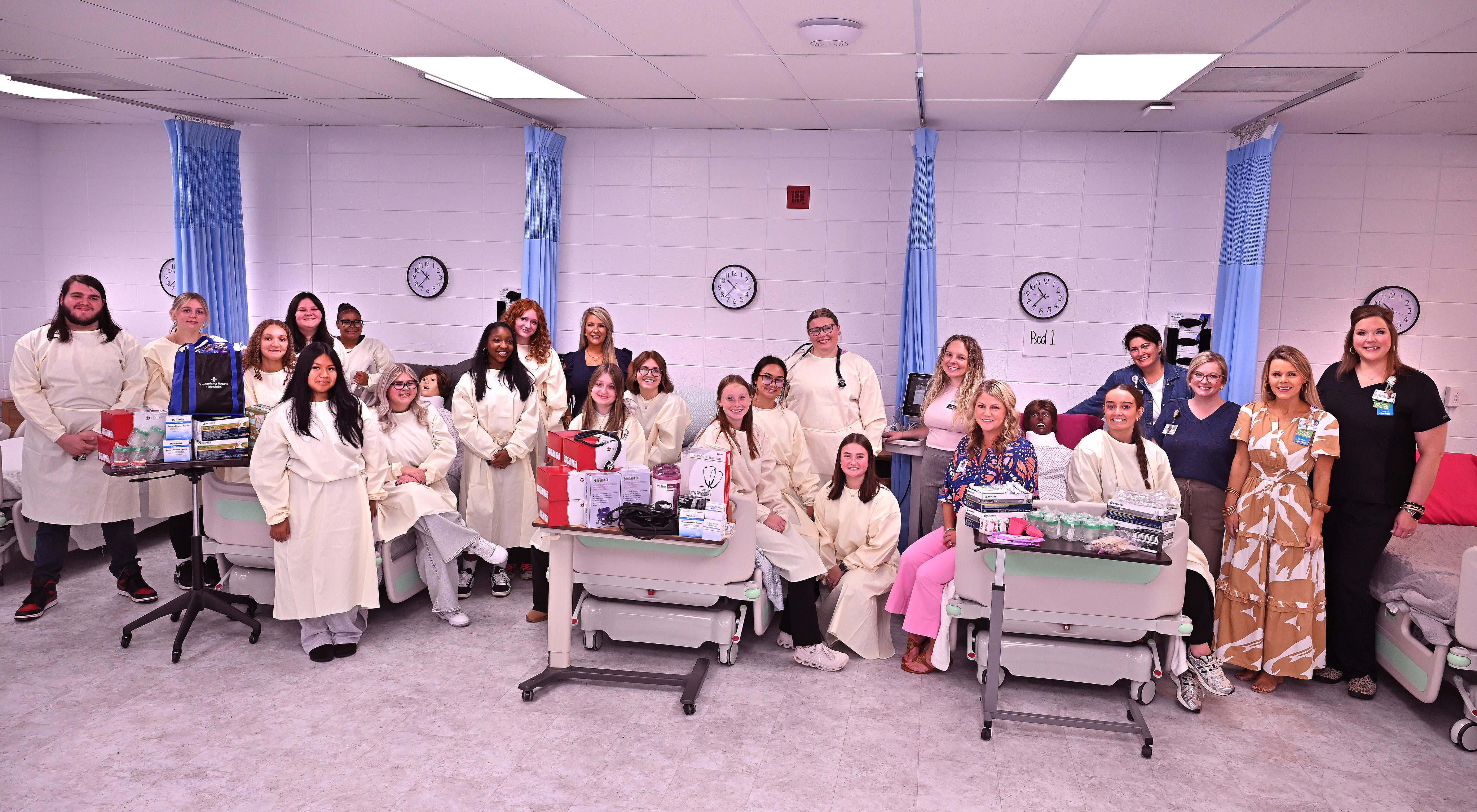 Students with leaders from Spartanburg Regional Healthcare System and Spartanburg Regional Foundation