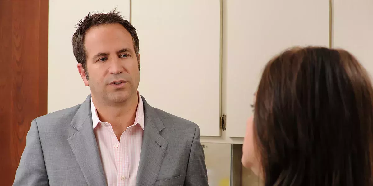 Michael Orseck, MD, of Medical Group of the Carolinas - Magnolia Plastic Surgery in Spartanburg gives a consultation to a female patient